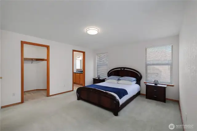 Another view of Primary Bedroom with doors to large walk-in closet and private 5-piece bathroom.