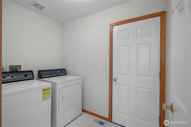 Laundry room with access to garage.