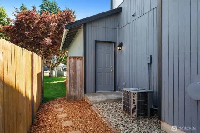 Side yard with access to garage and view out to street.