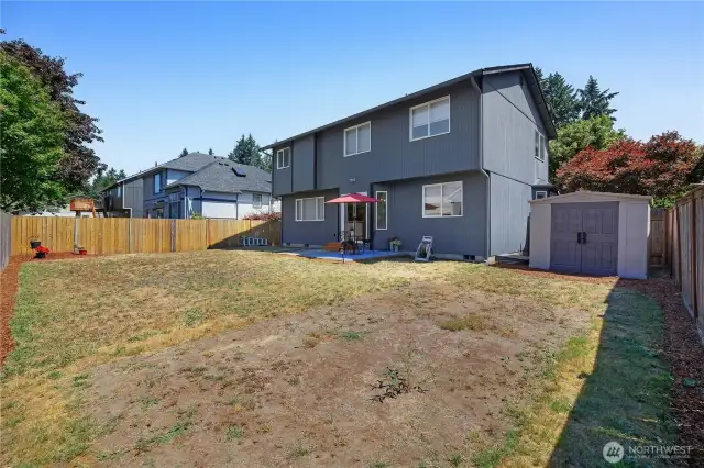 Fully fenced backyard with shed for all your goodies.