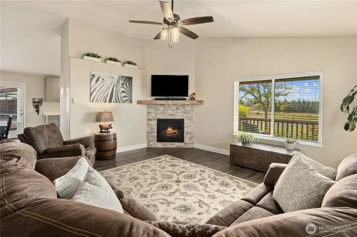 Lovely great room with natural gas fireplace with stone facade and mantle.