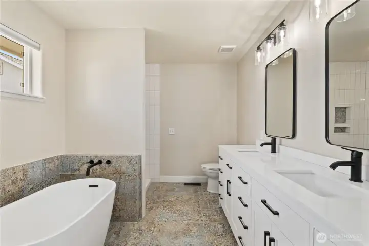 New full bath off primary - new tile, new shower tile, new vanity, new mirrors and all new fixtures!