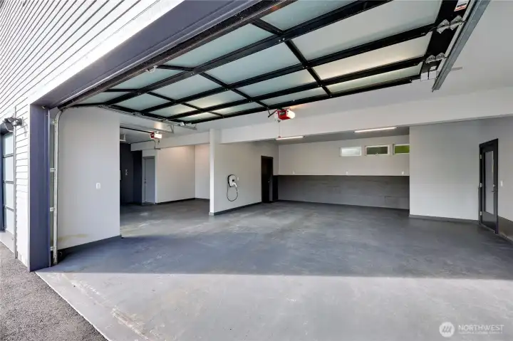 Oversized 3 car garage with EV charger.