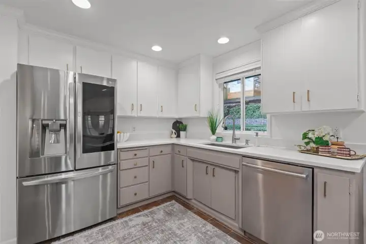 Enjoy modern conveniences with a newer LG InstaView fridge, touchless faucet, and updated dishwasher