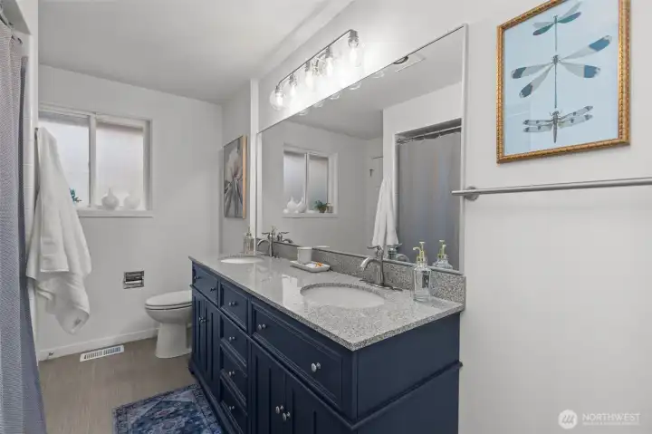 Freshly painted and updated, featuring a spacious double-sink vanity.