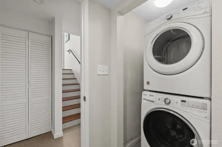 Full sized stackable washer and dryer conveniently located in lower level bathroom.