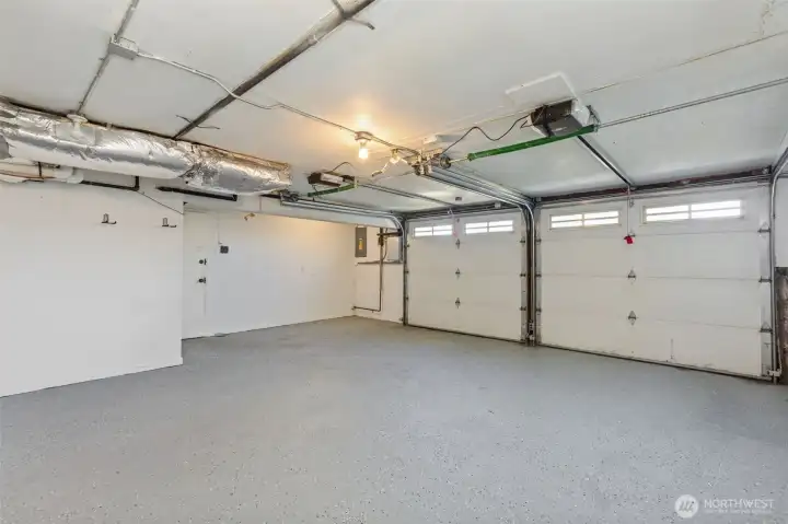 Oversized 2-car garage with extra room for a freezer and storage.