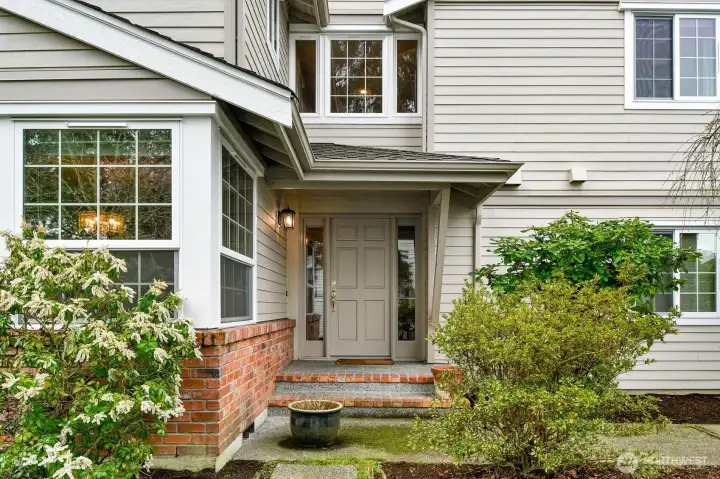 Beautiful new doors and windows greet your guests. (You will enter through your roomy, attached 2-car garage.)