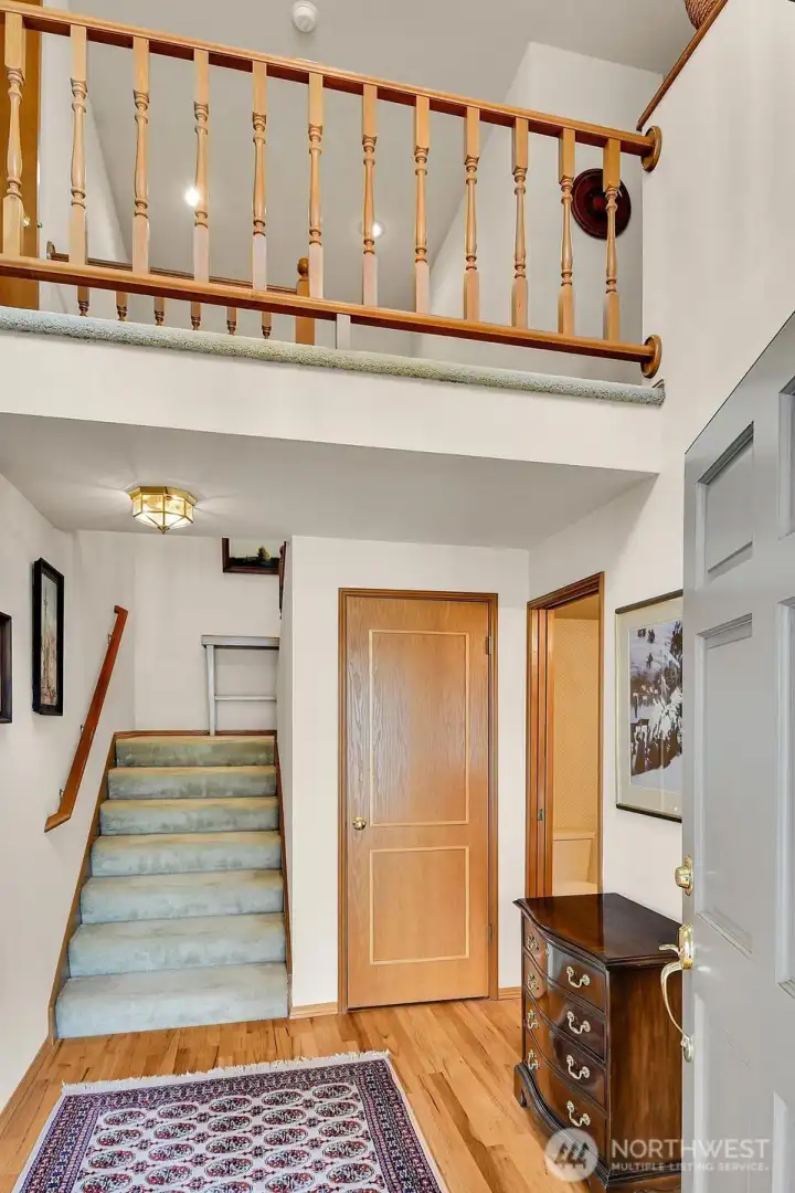 Elegant two-story entry with chandelier creates an open and airy welcome.