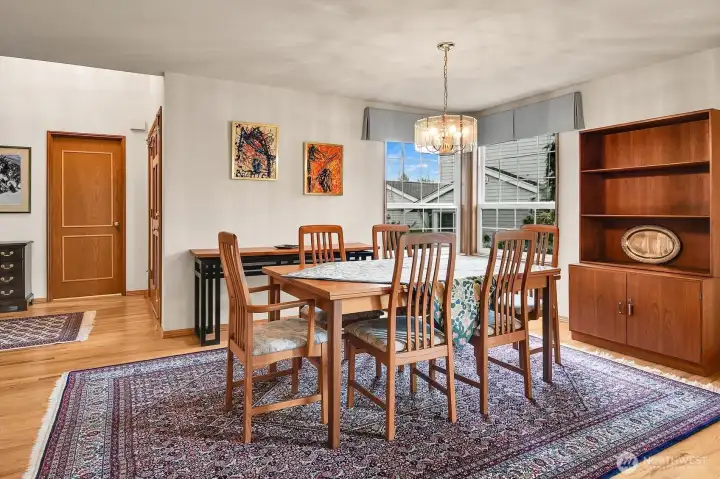 The formal dining room is graced with gleaming hardwood flooring. Perfect for entertaining, large holiday gatherings or intimate candle-lit dinners.
