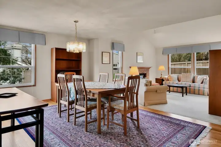 Living and dining rooms flow together in this open-space floor plan, ideal for entertaining and activities like puzzles and board games. Inset lighting in both rooms keeps them bright; dimmers provide “mood lighting”  for a more relaxed environment.