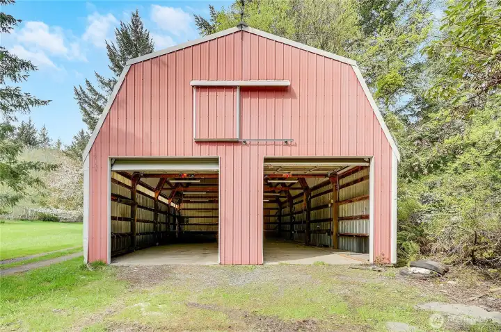 The 1,200 square foot, tall "shop" has power, very tall doors and a barn door above. A great space for a workshop, car and farm equipment or any number of hobbies.