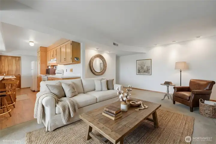 The living space in the lower level includes a full kitchen, two bedrooms, a 3/4 bath, and living room. The living area of this photo is virtually staged, but the  kitchen is "real".  Great space for guests, a caretaker, or short-term rental.