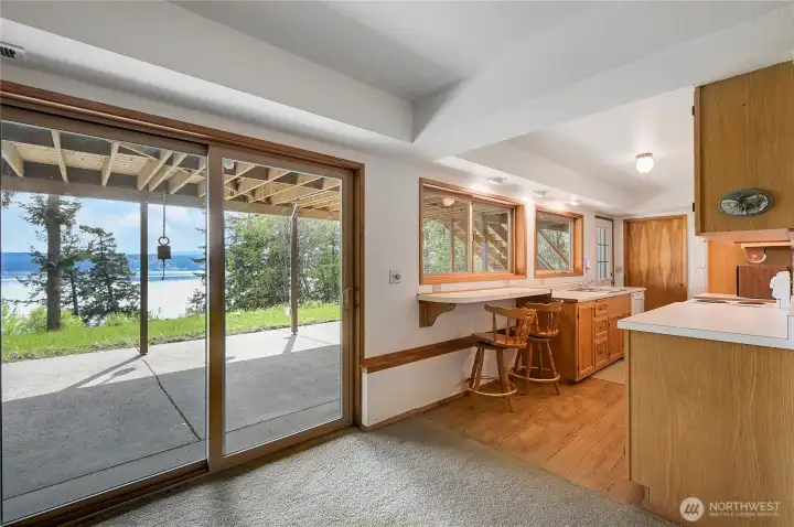 The daylight basement has two bedrooms, a 3/4 bath, a full kitchen, private access through two doors and water views! Great space for a rental, a live-in caregiver, or a wonderful private space for overnight guests.