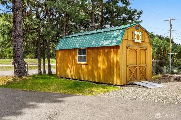 Garden shed building exterior with large access door