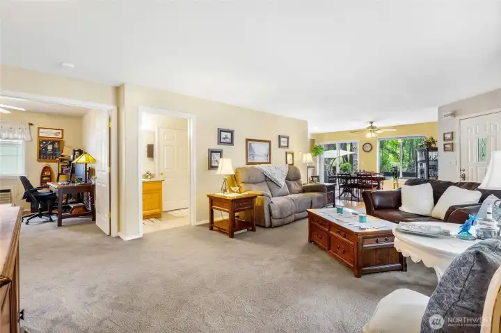 Living room with carpet flooring and open layout