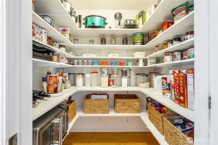 Walk-in pantry with built-in shelving