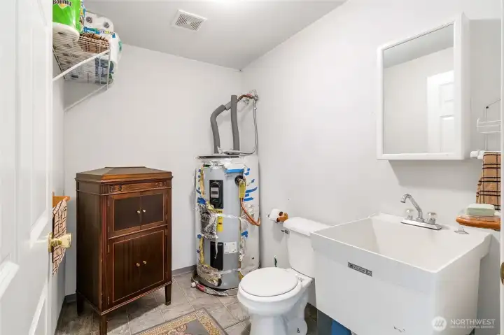 Additional bathroom in shop with vanity and fixtures