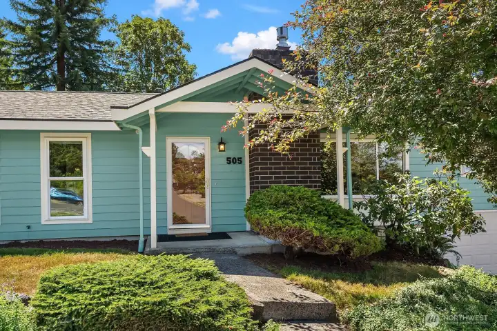A clear, locking storm door adds natural light and security at the entry, while new six-panel solid-core doors continue throughout the home.