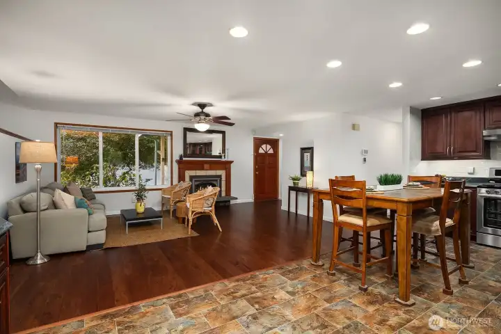 A wide-open main level showcases the impact of the thoughtfully removed wall, creating a spacious and connected gathering area.