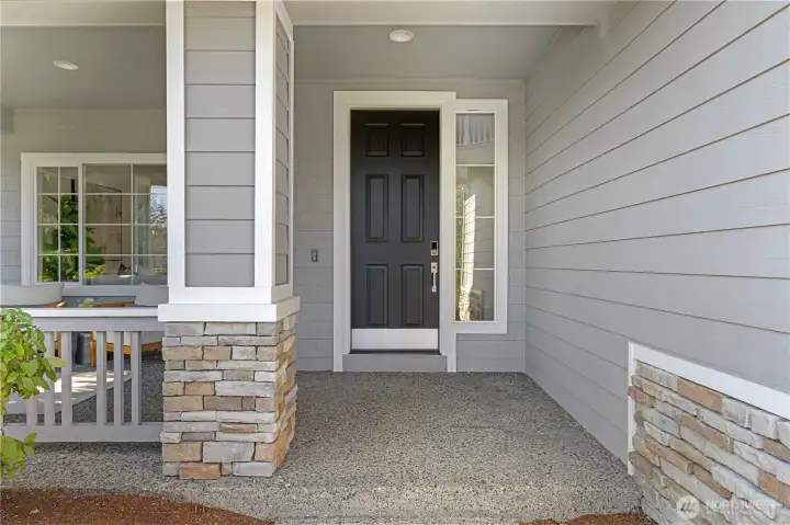 Entry with concrete porch for easy maintenance.