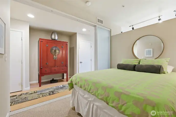 Bedroom with sliding doors open.