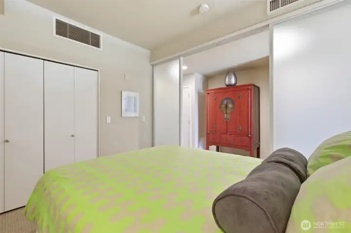 Bedroom with doors partially closed.