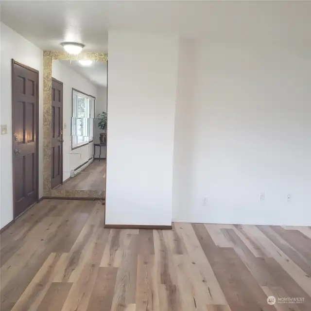 When you come in the front door, you have an entry area with coat closet available before stepping into the living room. Brand new luxury vinyl plank flooring here and everywhere in the home.