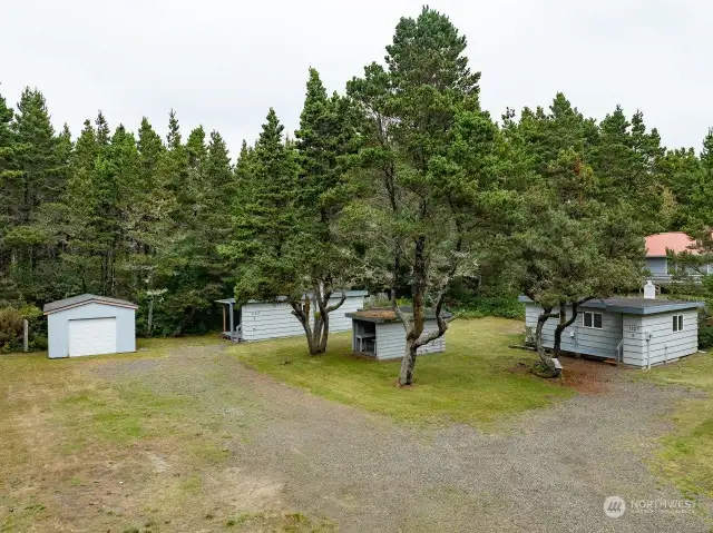 Two Cabins with a laundry area in center & garage (left)