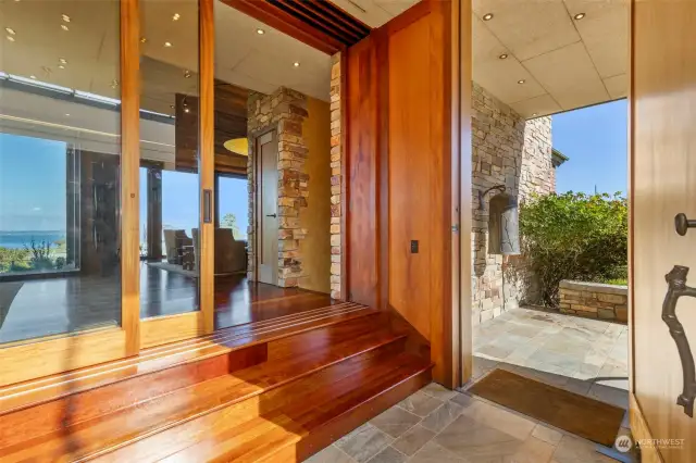 Heading past the entry to the living/dining room.  Doors to the left are a full wall of pocket doors.