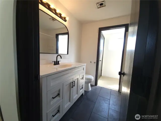 New vanity, fixtures & tile flooring