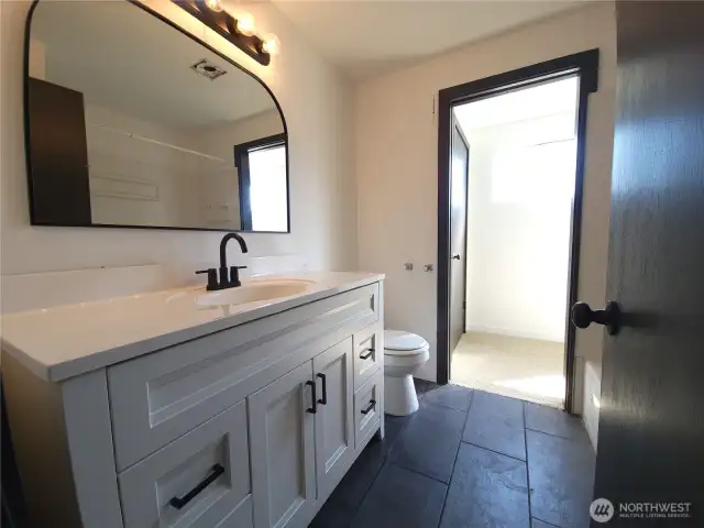 Bath is accessible from primary bedroom
