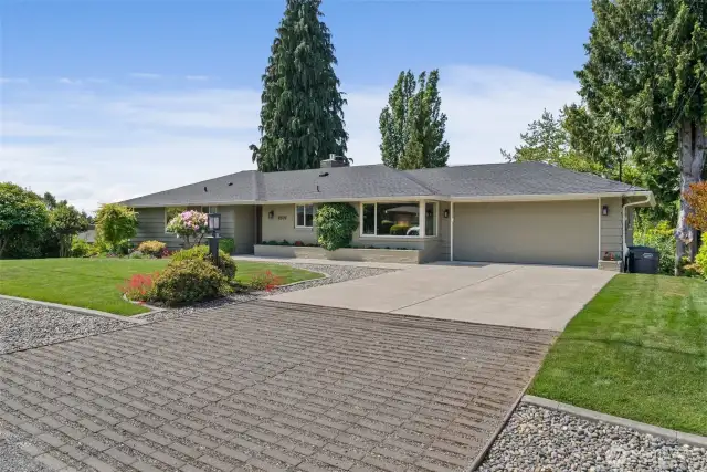 Perfect blend of hardscape elements give this house the wow of curb appeal.
