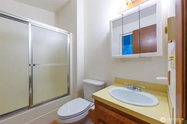 primary bathroom with tub and shower