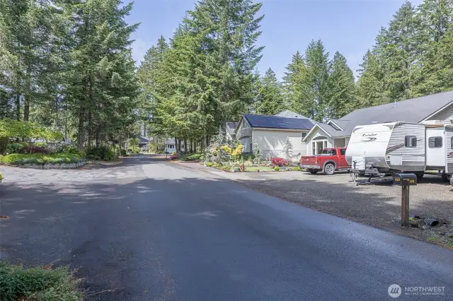 Past the home leads into the culdesac and an easy walk to courts, picnic area and community garden.