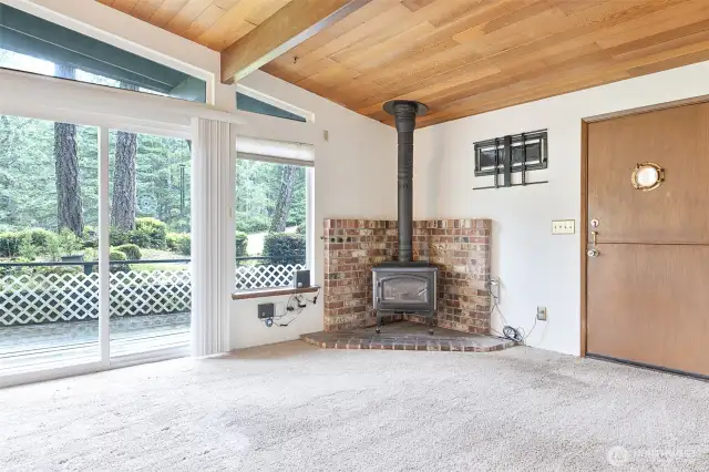 check out the woodstove fireplace and Dutch door with a porthole window