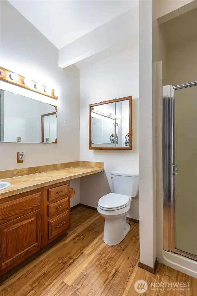 hallway bathroom with a shower