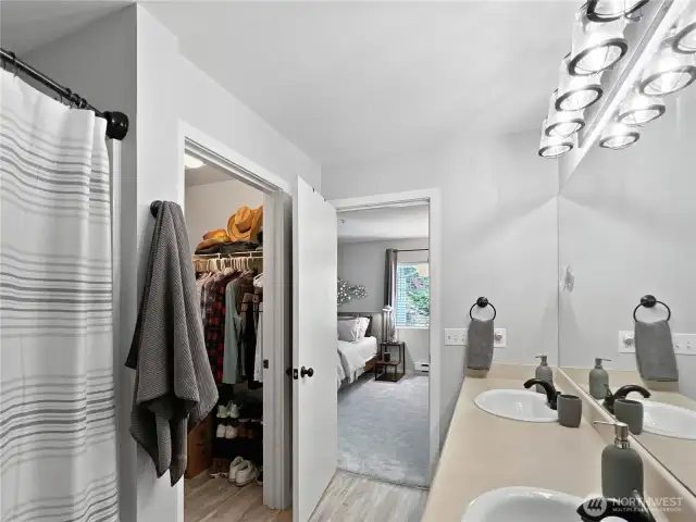 Primary Bathroom features a walk-in closet and spacious countertops.