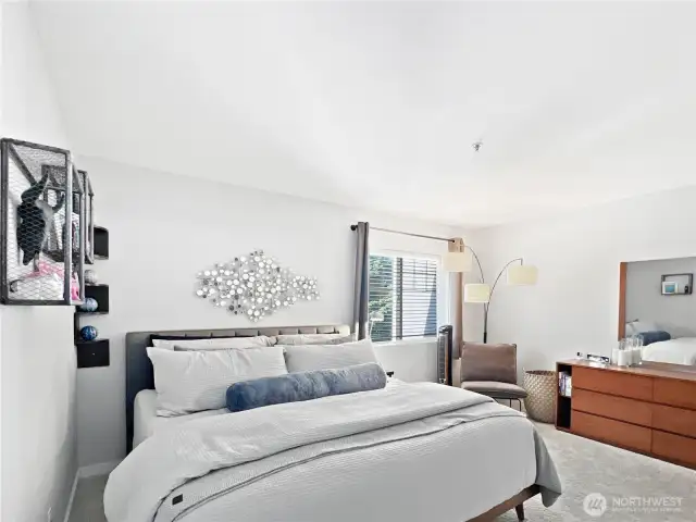 The primary bedroom fits a king size bed, plus dresser and still plenty of room to relax.