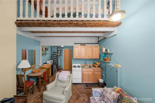 Lofted area sits right above kitchenette