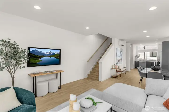 Cozy living nook with ample room for a sectional and media center designed for relaxed nights in.