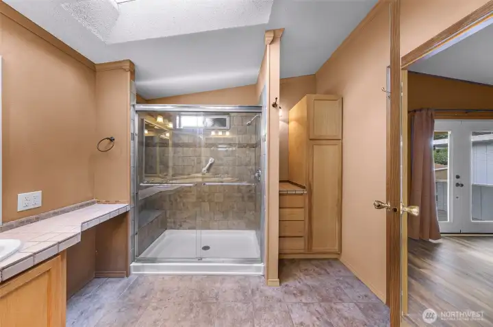 Plenty of natural light and counter space, additional linen storage too!