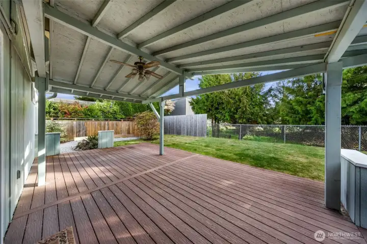 Private covered back porch off primary bedroom. Imagine having morning coffee    back here!