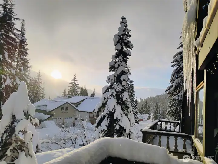 Mountain living in the winter. A view from your neighbors of your newly built garage.