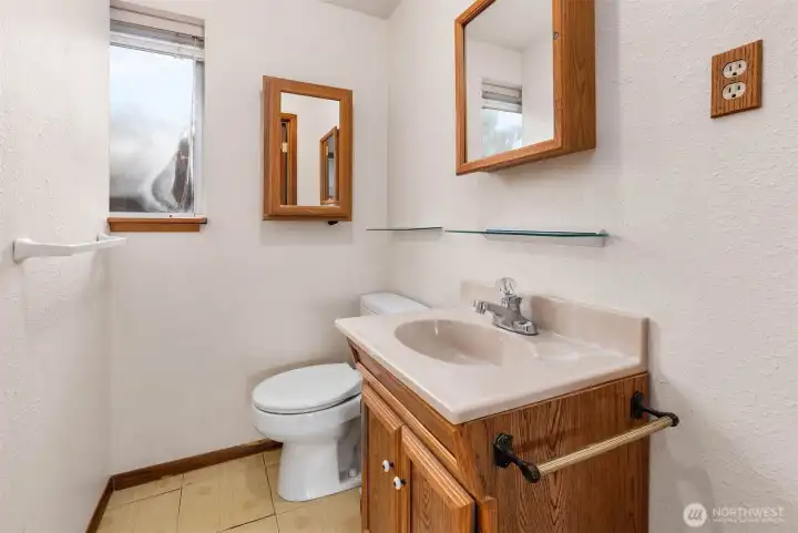 Half bathroom in primary suite.