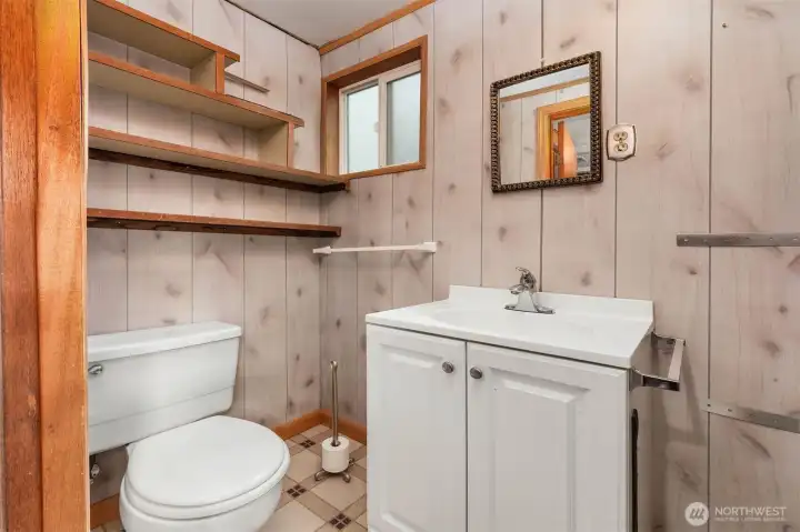Half bathroom located off of utility room.
