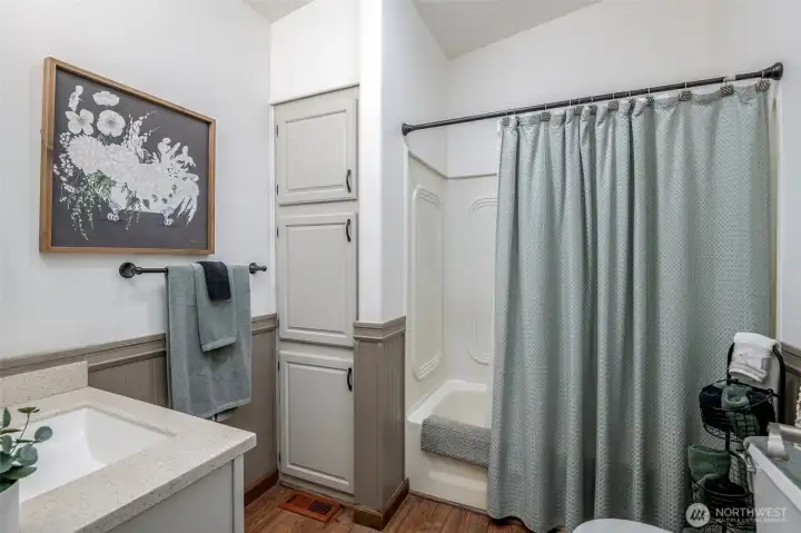 Full hall bath with plenty of space and storage.