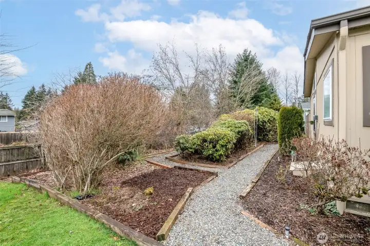 Additional backyard space blooms with bold colors Spring- Fall.