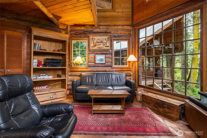 Logs make up all the walls and floors are fir