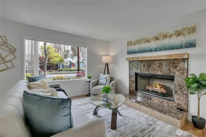 Living room with cozy fireplace and natural light